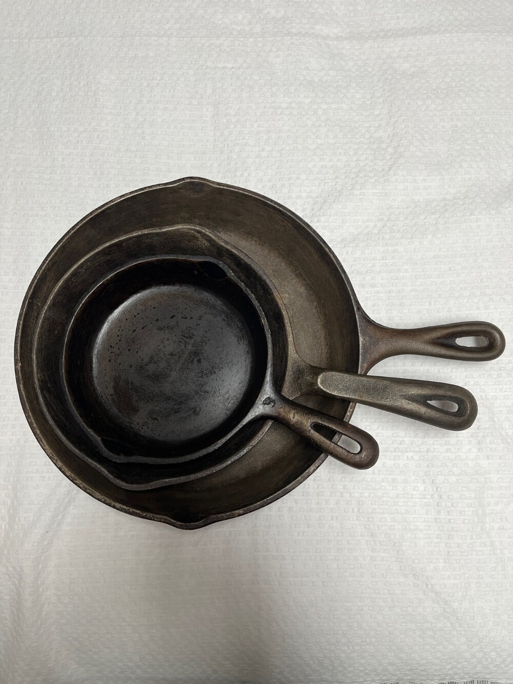 Cast iron skillet set 6,8,10" Unbranded, Wagner's 1891, and Lodge.
